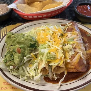 Combo meal with chicken flautas, shredded beef enchilada and refried beans.