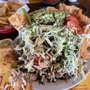 My huge taco salad in the front.  You can see the 3 x taco plate at the top of the photo.