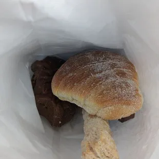 a person holding a bag of food