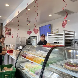a man and woman in a bakery