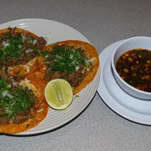 Birria Tacos served with customary and authentic Birria (Beef Broth).