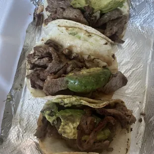 Cold Mexican style tacos... with browned avocado and ZERO toppings.