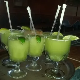 three glasses of lime margarita