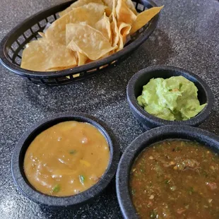 Salsa, cheese dip, and guacamole.