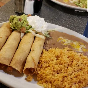 A plate of flautas with all the fixings!
