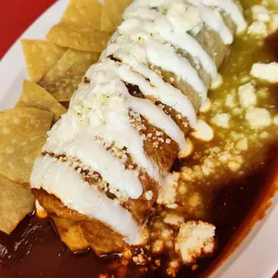 a plate of enchilada and tortillas