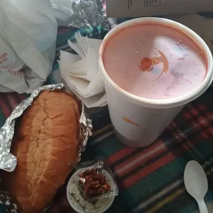 Large menudo to go. Came with oregano, onions, crushed red pepper and a torta bun.
