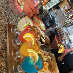 This is our Muchacho Flight. 4 small margaritas on the rocks you pick your flavors and the rim has tajin and chamoy! 
Board the flight