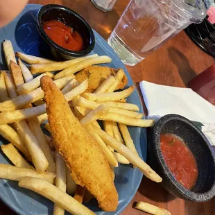 Kids chicken tenders and complimentary salsa on top chips not pictured
