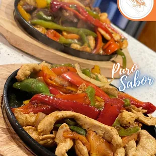 two plates of chicken and peppers