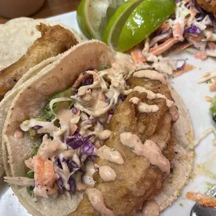 I ordered #11 fish tacos. Lots of fish and the spicy Mayo, coleslaw, and avocado come on the side to dress yourself.