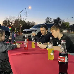 a group of people sitting at a table