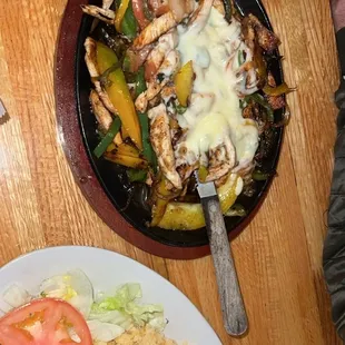 a plate of food and a bowl of rice