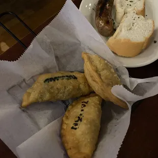 Chorizo, three empanadas (Jamon y Queso Empanada, Tucumana Empanada, Pollo Empanada)