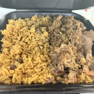 yellow rice with pigeon beans and pork shoulder shredded.