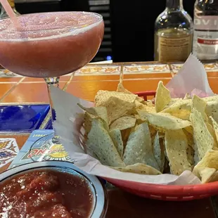 Complementary chips and salsa out of this world. That is a non-alcoholic frozen raspberry margarita. Wonderful!