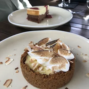 Lemon meringue tart (foreground) and triple chocolate cheesecake (background)