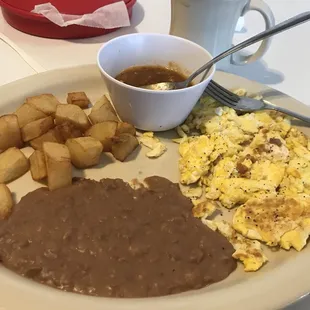 Huevo Ranchero plate with coffee and flour tortillas