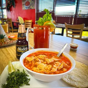 Menudo, served with a beer and a michelada