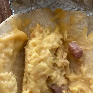 Skimpy tacos with two pieces of ham, no bacon. Paid about $20 for 6 tacos. These guys are crooks