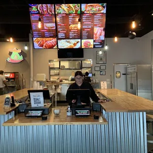 a woman behind the counter