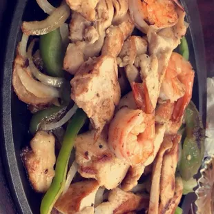 a plate of shrimp and vegetables