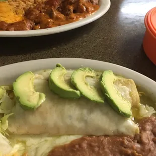 a plate of enchiladas and rice
