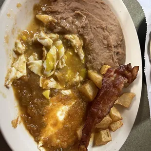 Huevos Rancheros with bacon, refried beans