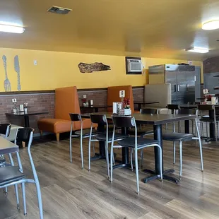 a restaurant with tables and chairs