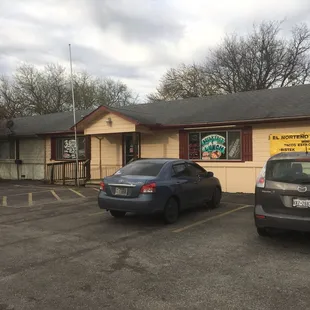 two cars parked in a parking lot