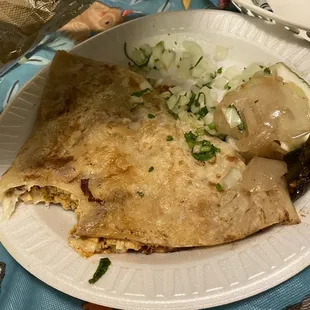 Half of a chicken quesadilla