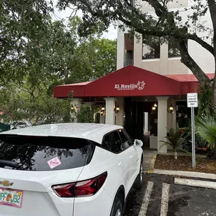 a car parked in front of the restaurant