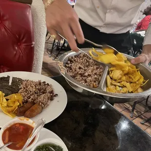 They com to you table with the sides, you can get as much as you want. Plantain chips and Gallo pinto