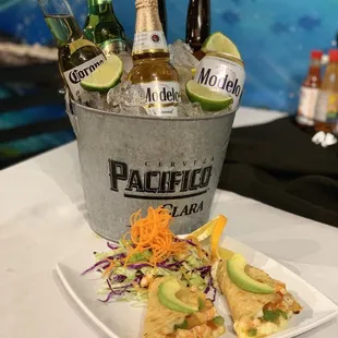 Beer bucket and 2 tacos Gobernador they had white mozzarella cheese, shrimp and bell pepper