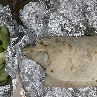 Asada burrito comes with lemons and some salsa