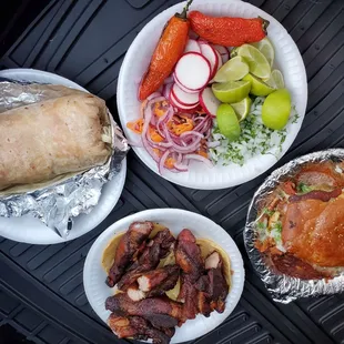 Carne asada burrito &amp; Torta, ribs and condiments.