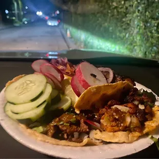 Taco assortment with condiments - asada, al pastor, chorizo, costilla