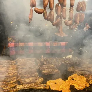 The grill with chorizo, costilla, asada, and chicken