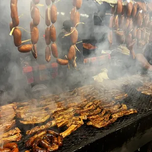 Grilling meats over mesquite coals!!