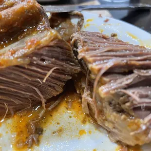 Juicy tender beef broke apart with fork.