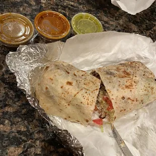 a burrito and condiments