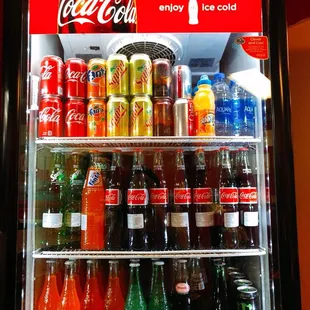 a refrigerator full of sodas