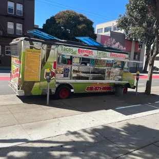 a food truck parked on the side of the road
