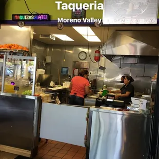 two people working in the kitchen