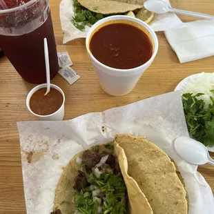 Tacos de Birria , consomé de birria and Jamaica water.