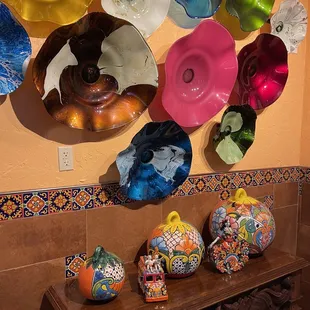 a collection of colorful vases