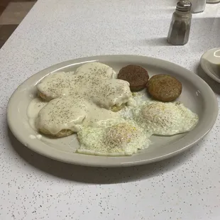 Eggs over medium with biscuits and gravy