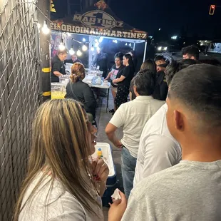 Long line for a hot dog