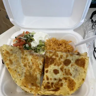 Carnitas quesadilla with beans, side of delicious Spanish Rice , Pico de gallo, Sour Cream and Fresh Guacamole Dip.