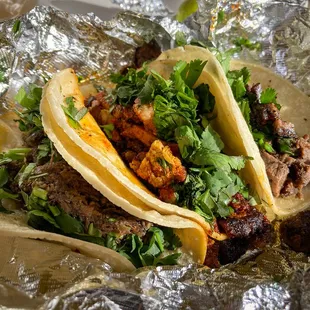 Three tacos, equal in glory.